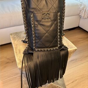 CHANEL Black Quilted Leather Fringe Backpack with Gold Chain Trim